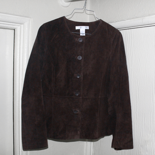 Brown suede jacket on a hanger against a white wall