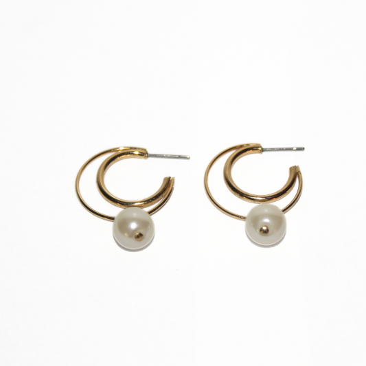 Gold hoop earrings with pearl beads on a white background
